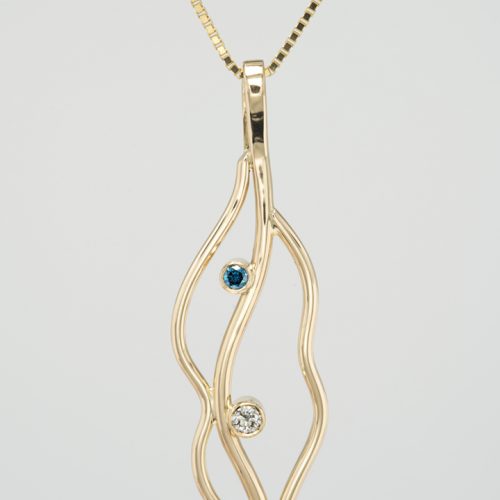 Gold necklace with blue and white diamonds