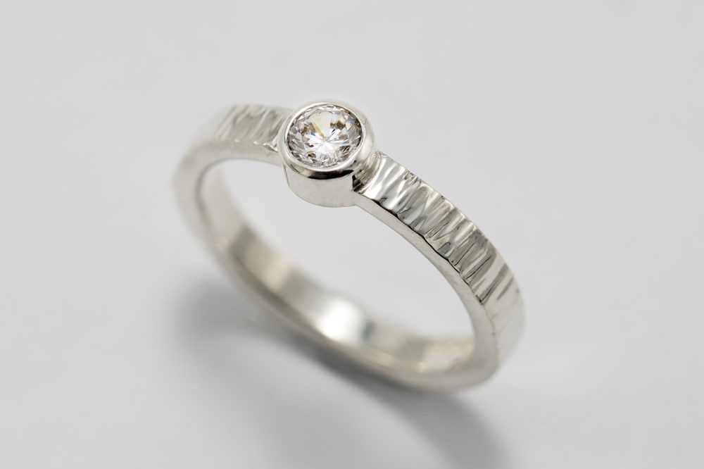 Textured silver ring with cubic zirconium