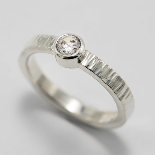 Textured silver ring with cubic zirconium