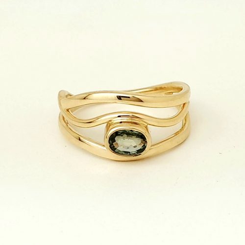 Gold ring with green sapphire